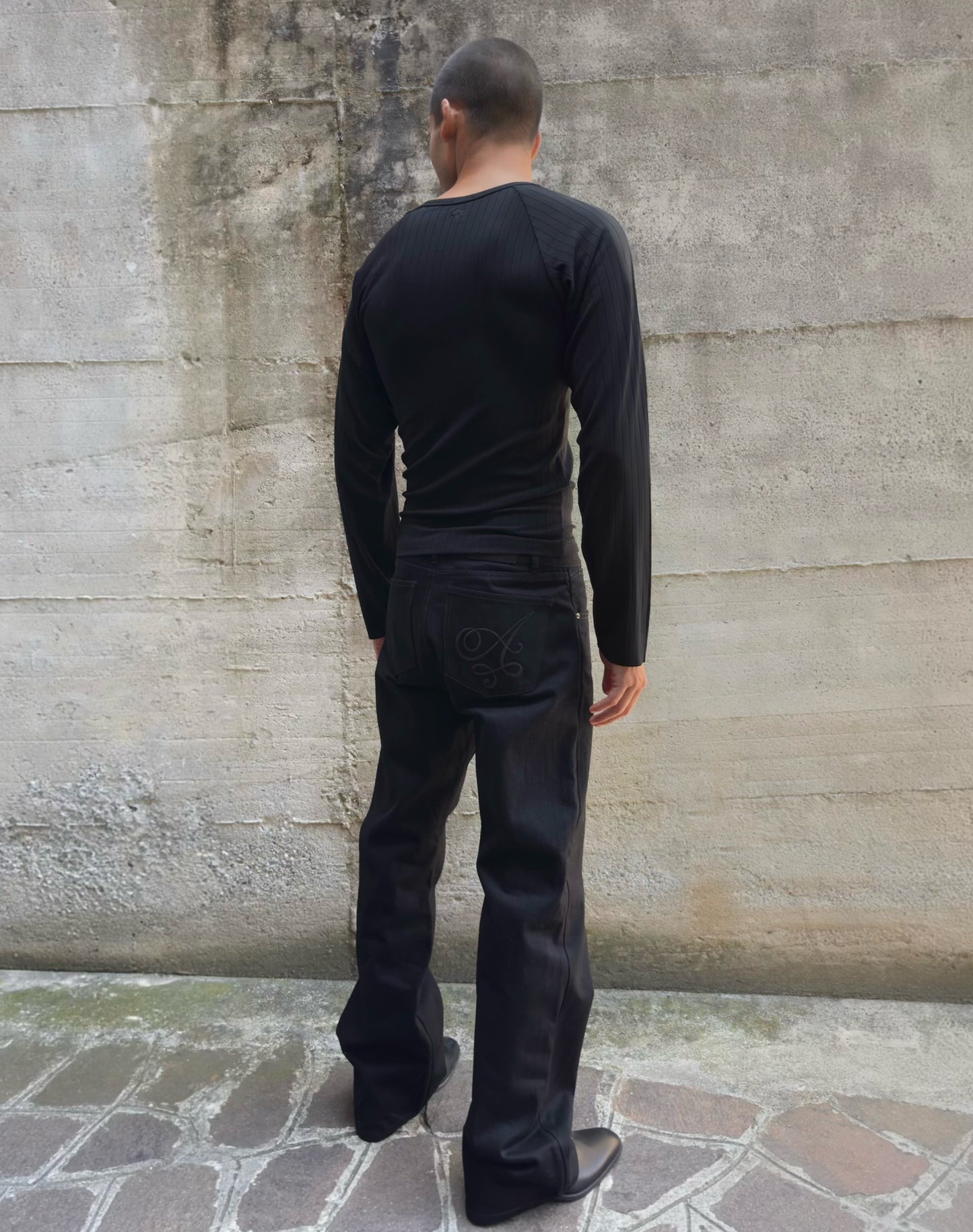 Jeans “Fusion Bootcut” in raw denim originale cimosato, ricamo e bottoni e rivetti in ottone logati