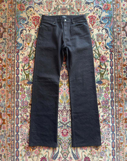 Jeans “Fusion Bootcut” in raw denim originale cimosato, ricamo e bottoni e rivetti in ottone logati