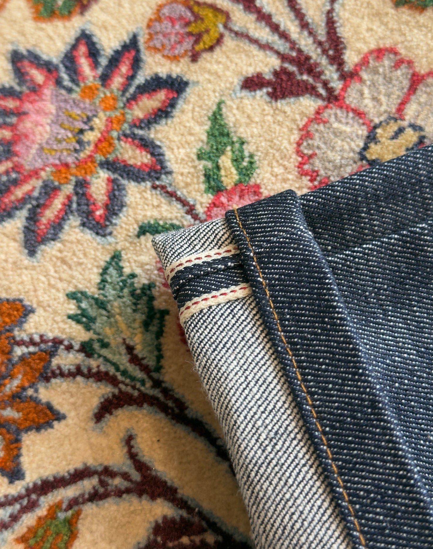 Jeans “Fusion Bootcut” in raw denim originale cimosato, ricamo e bottoni e rivetti in ottone logati