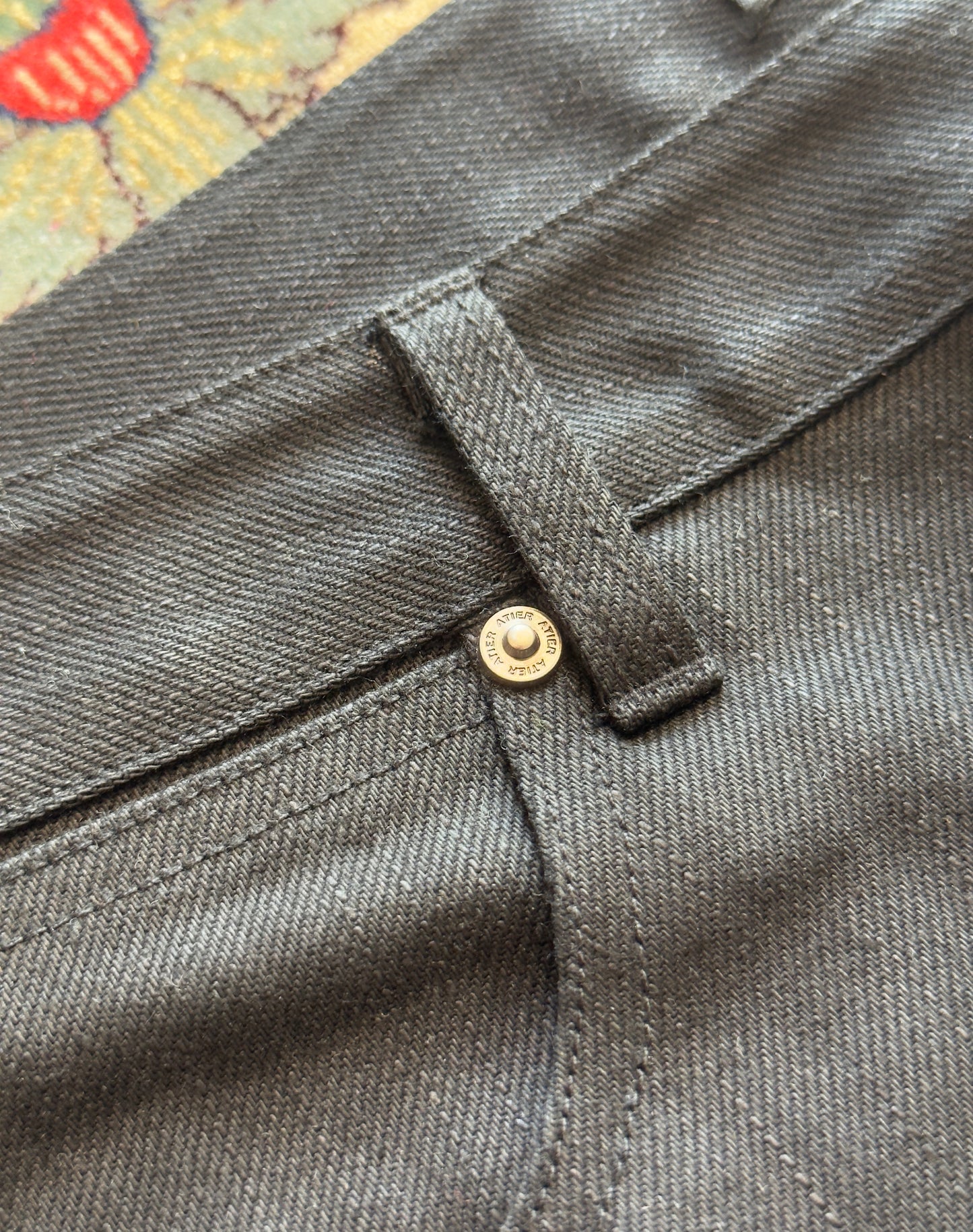 Jeans “Fusion Bootcut” in raw denim originale cimosato, ricamo e bottoni e rivetti in ottone logati