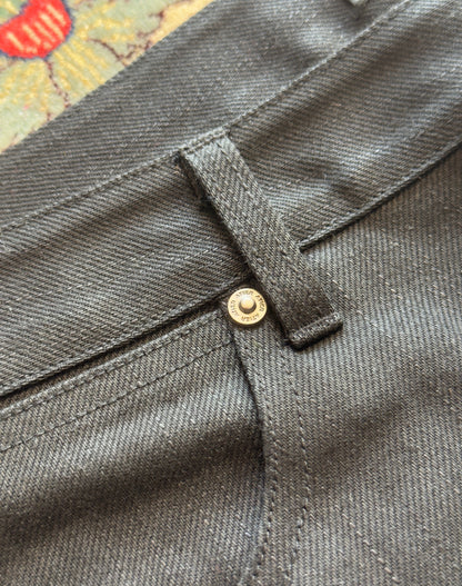 Jeans “Fusion Bootcut” in raw denim originale cimosato, ricamo e bottoni e rivetti in ottone logati