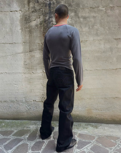 Jeans “Fusion Bootcut” in raw denim originale cimosato, ricamo e bottoni e rivetti in ottone logati
