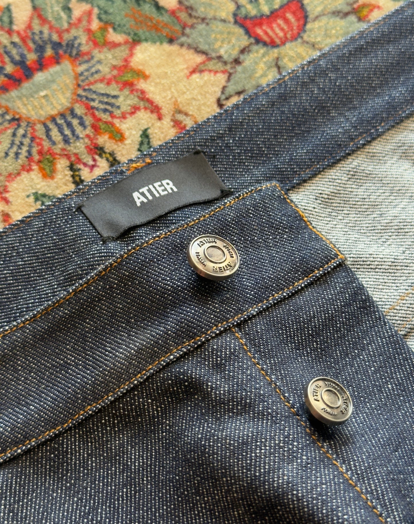 Jeans “Fusion Bootcut” in raw denim originale cimosato, ricamo e bottoni e rivetti in ottone logati
