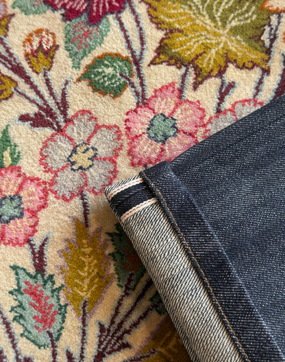 Jeans “Fusion Bootcut” in raw denim originale cimosato, ricamo e bottoni e rivetti in ottone logati