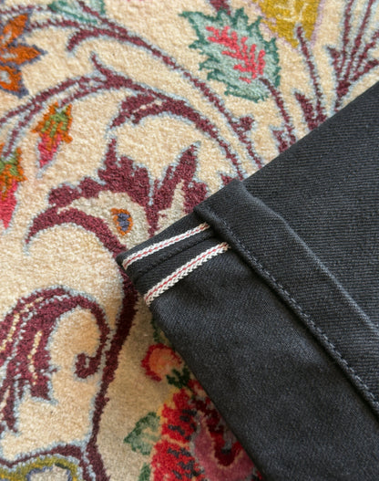 Jeans “Fusion Bootcut” in raw denim originale cimosato, ricamo e bottoni e rivetti in ottone logati